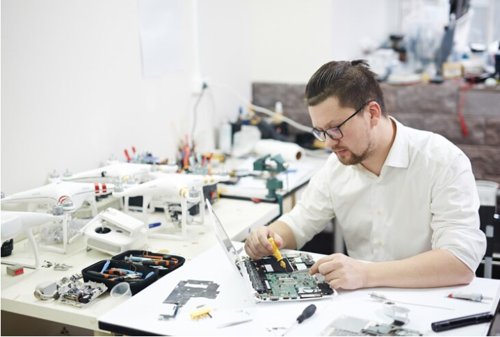 Technician working on laptop